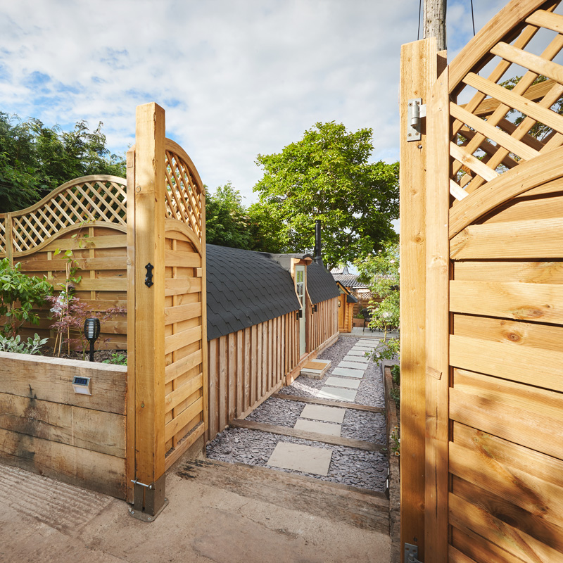 wood gate and fence to a walkway