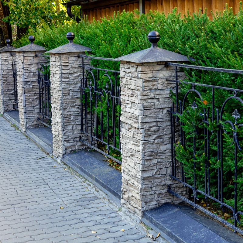 stone and wrought iron fencing